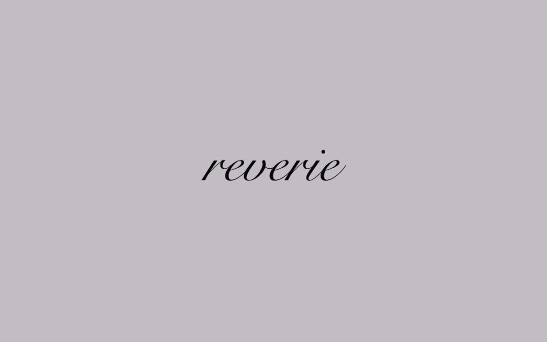 Small text tattoo design reading "reverie"